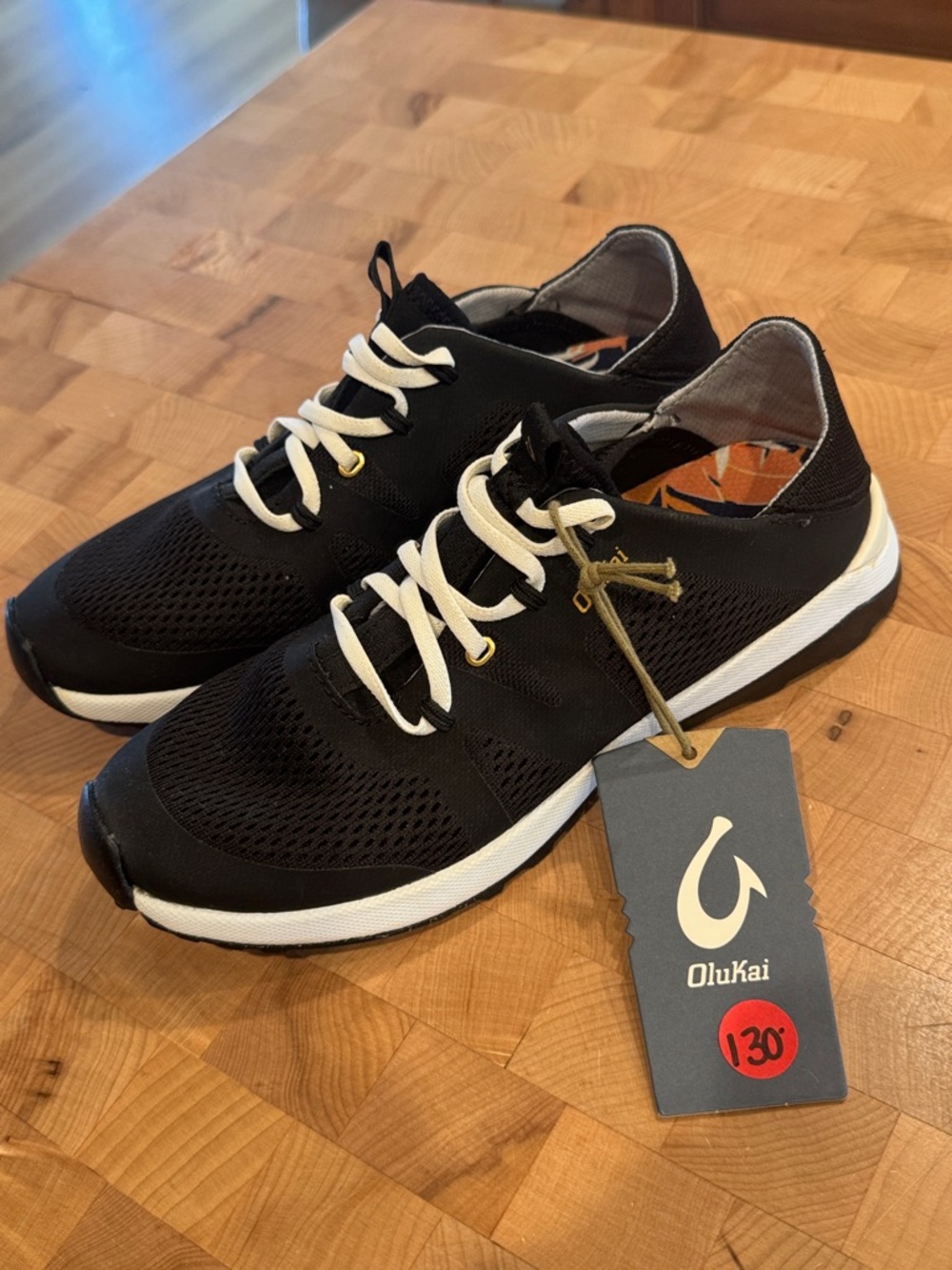 OluKai Women’s Black Sneakers with White Accents